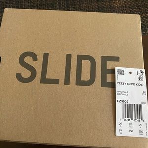 Brand new kid Yeezy slides size 8 never been worn.